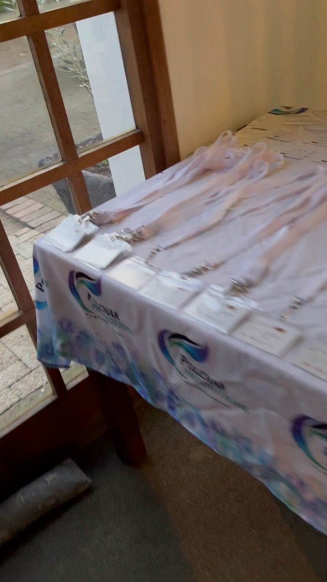 Polchar-branded event linen with delegate lanyards and welcome packs